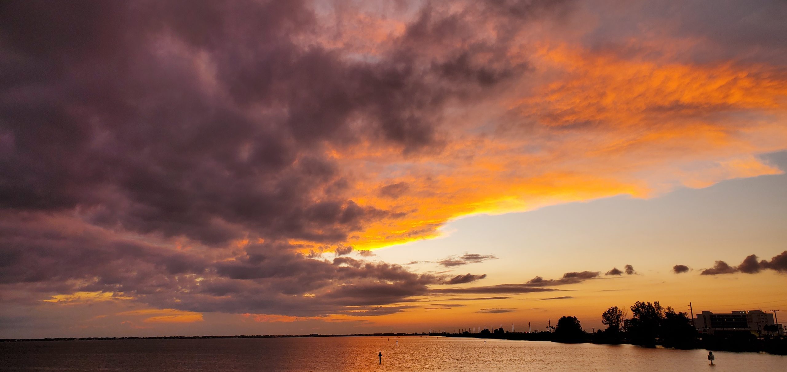 Colorful pink and orange sunset clouds over the Space Coast